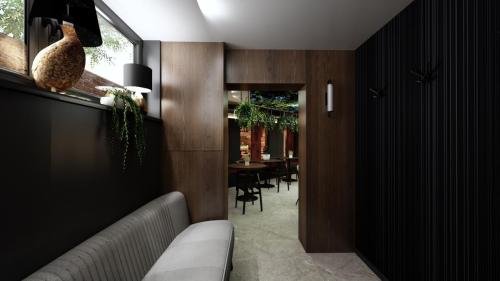 NOWOCZESNY KLUB Z SUFITEM PODWIESZANYM I CEGŁĄ