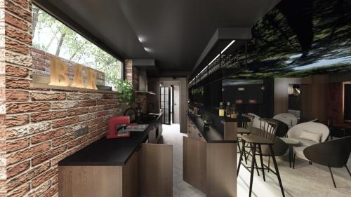 NOWOCZESNY KLUB Z SUFITEM PODWIESZANYM I CEGŁĄ