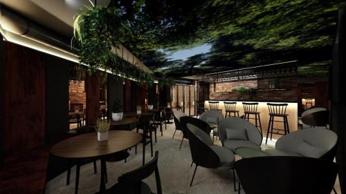 NOWOCZESNY KLUB Z SUFITEM PODWIESZANYM I CEGŁĄ